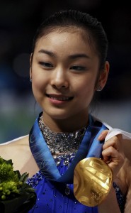 Vancouver Olympics Figure Skating South Korea's Kim Yu-Na poses with the gold medal during the medals ceremony for the women's figure skating competition at the Vancouver 2010 Olympics in Vancouver, British Columbia, Thursday, Feb. 25, 2010. (AP Photo/Mark Baker)