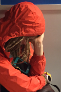 A young woman sporting blonde dreadlocks.